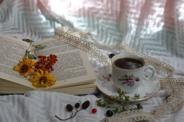 Autumn still life with a book and a cup of coffee