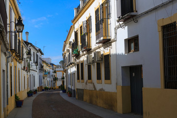 Naklejka na ściany i meble Cordoba,Spain,2,2014;White architecture and traditional street