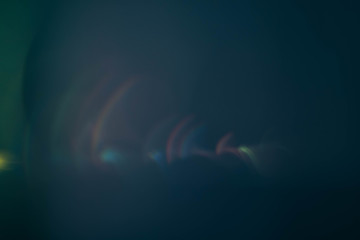 Teal blue abstract art background. Defocused colored lens flare glow. Blur colorful lines.