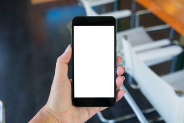 hand of woman holding mobile smart phone with empty white screen background.