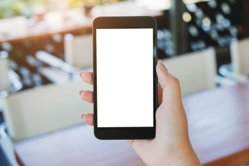 hand of woman holding mobile smart phone with empty white screen background.