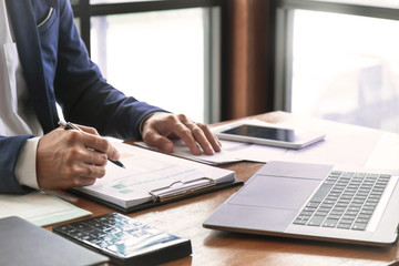 Fototapeta premium auditor or financial inspector working on business report