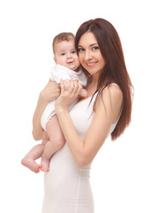 Portrait of mother and her little child in white. Happy family concept. Mother holding cute baby isolated on white background. . Motherhood and children concept. Close up - 286245154