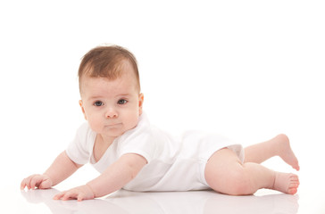 Cute baby isolated on white background. Happy childhood. Close up portrait of happy baby. Fun kid in white pajama on white