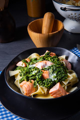 pappardelle pasta with creamed spinach and fried salmon