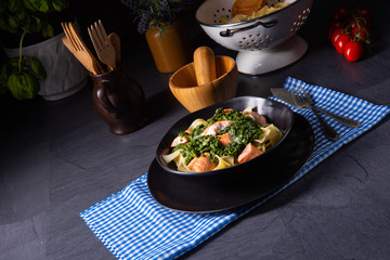 pappardelle pasta with creamed spinach and fried salmon
