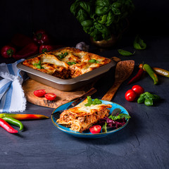 spicy lasagne with tomato sauce and basil
