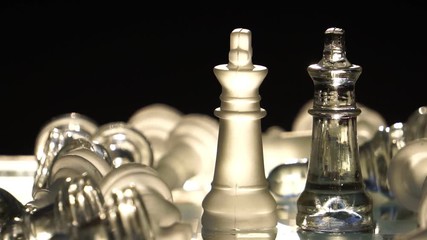 The concept of business competition: Close-up of a businessman holding a glass chess footage slow motion