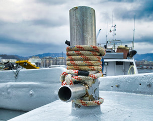 detail of a rope around a bollard