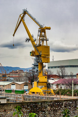 Fototapeta na wymiar yellow old crane in a shipyard