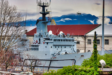 old military ship in a shipyard