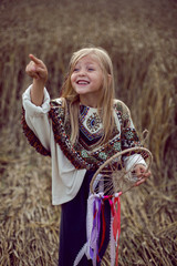 girl Indian shaman blonde in a poncho