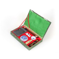 Open box with set for chinese traditional ink drawing isolated on white background