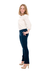 Fototapeta premium Portrait of a cheerful young woman in jeans isolated over a white background