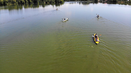 River kayaking top view from drone. Canoe group going by the river.