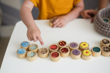 mother plays with sensory toys with child disabled