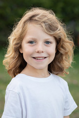 Funny blond kid with long hair