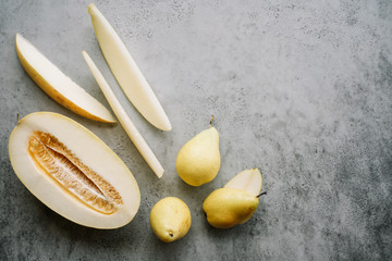 Fresh melon piece and pears. Creative layout ripe fruits. Food concept