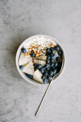 Breakfast bowl with cottage cheese or yogurt, blueberries, chia seeds and almonds. Healthy breakfast concept