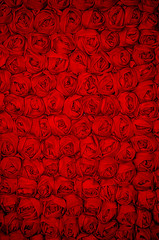 Red fabric rose flowered background
