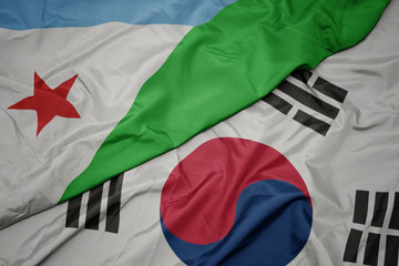 waving colorful flag of south korea and national flag of djibouti.
