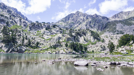 Mountains landscape with lake in summertime