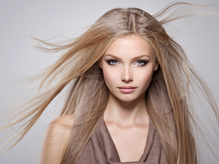 Beautiful young woman with long straight white hair