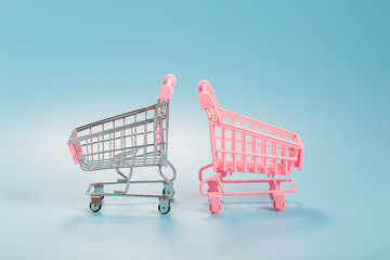 Shopping cart over blue green background