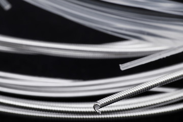 Macro shot of classical guitar strings on black background