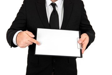 Businessman holding a clipboard with a blank paper. Standing in front of a white background.