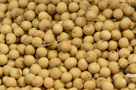 Thai fruit longan background. Longan exotic fruit for sell in street market, Thailand, close up, top view