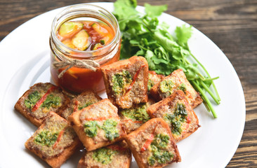 Fried toasts with Minced Pork Spread with chili sauce (Thai Pork Toast) . Toasts Menu for children.