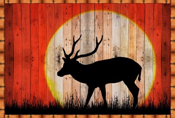 silhouette deer in the forest on sunset   on a wooden sign