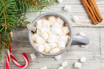 Winter hot drink. Christmas hot chocolate or cocoa with marshmallow on white with christmas decorations