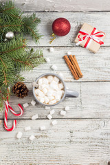Winter hot drink. Christmas hot chocolate or cocoa with marshmallow on white with christmas decorations