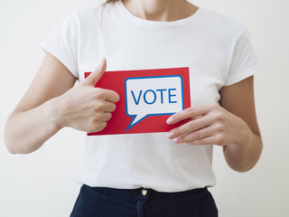Fototapeta na wymiar Woman showing red card with voting speech bubble
