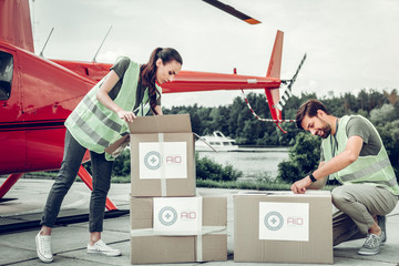 Humanitarian workers unpacking boxes after receiving them