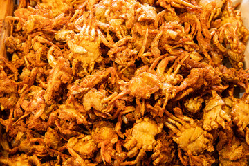 Delicious deep fried crispy small crabs, popular Thai street food snack.