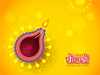 Illuminated oil lamp (Diya) on yellow floral pattern background for Happy Diwali celebration can be used as greeting card design.