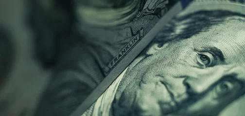 Fotobehang Close up Franklin's face  on a one hundred dollar. American, US Dollars Cash Money background. © Oleksandr