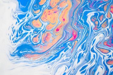 Abstract colorful painting background made in fluid art technique. Fluid art pattern in trendy colors with glitter.