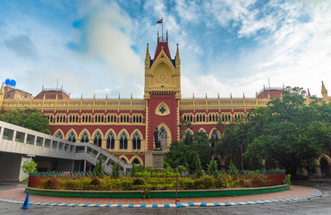 The Calcutta High Court is the oldest High Court in India. In front of the statue it is written In...