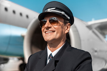 Close up of smiling man in uniform resting after work © Yakobchuk Olena