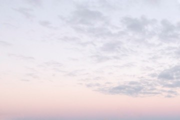 Obraz premium Background with small clouds on sunset sky. Nightfall is on.