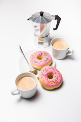 Fresh hot coffe and pink sweet donut on white background isolated