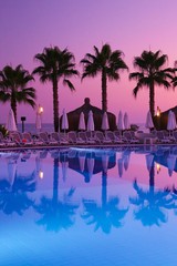 Tropical seashore with palms in the night with moonlight and clear sky.Antalya /Turkey