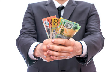 Man in suit offer australian dollar banknotes