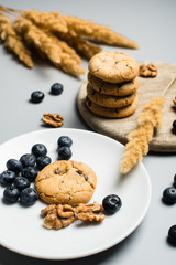 Freshly baked cookies with blackberry and nuts, studio shot