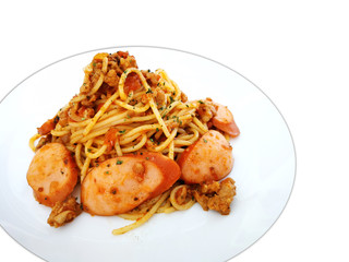 Spaghetti with hot dog slices and ketchup sauce, The Spaghetti Pasta In Creamy Tomato Sauce with hot dog in white plate on white blackground.Tasty appetizing pasta served with tomato sauce-Image