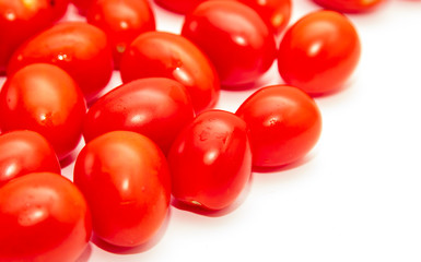 Red cherry tomatoes on a white background